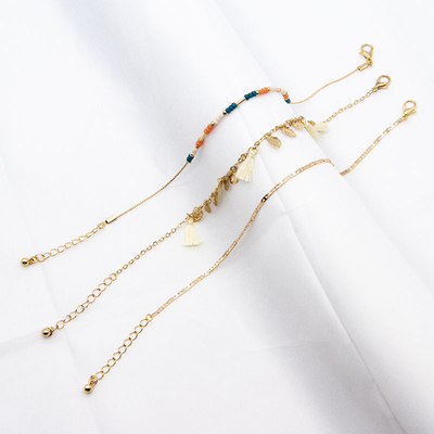 la cavità in rilievo dei gioielli dei braccialetti di 26mm lascia il tatto della nappa con le perle acriliche blu arancio