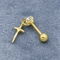 Il chiaro orecchio dell'oro delle gemme della CZ fissa gli orecchini che perforanti dell'elica 16G con l'incrocio ciondolano